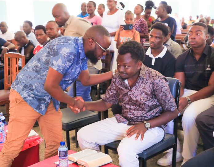 UDA National Youth leader, Cedrick Mike Otieno confers with George Ruto in Kisumu. Pic by Geofrey Kasera